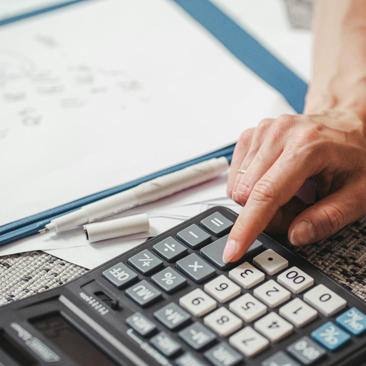a person using a calculator